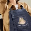 SERIE I MOSTRI CADONO NELLA NATURA SELVAGGIA – Borsa grembiule in denim
