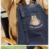 SERIE I MOSTRI CADONO NELLA NATURA SELVAGGIA – Borsa grembiule in denim